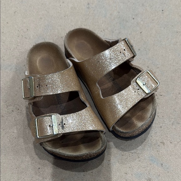 Kids gold and Brown Birkenstock Sandals
28 translates to an 11 1/2 or 12 - Picture 1 of 5